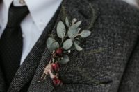 17 a winter boutonniere of greenery and burgundy berries is a fresh touch of color and frost at the same time