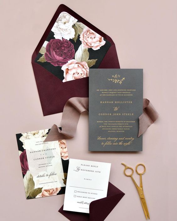 a refined burgundy and grey weddin invitation suite with floral lining and gold letters