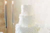 18 a white wedding cake with lots of sugar flowers attached is an utterly romantic and purely elegant idea