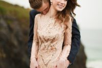 18 an elegant blush and gold sequin wedding dress with a low back and long sleeves to stand out with color and sparkles