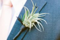 20 an air plant boutonniere with a dark wrap for an edgy feel and a bright look