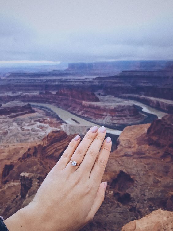 incorporate the amazing views of the location into your engagement pics, like here, the Rockies