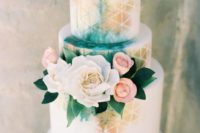 25 a neutral wedding cake spruced up with bold watercolor in turquoise and gold touches plus pink and white blooms