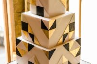 26 an art deco inspired wedding cake with white, black and gold triangles on white is a chic idea to rock