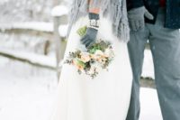 26 grey embellished gloves match the cable knit coverup of the bride making her look complete
