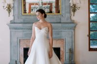 a beautiful and elegant strapless wedding ballgown with a draped bow bodice, a plain and pleated skirt and a train for a formal wedding
