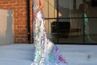 a breathtaking iridescent mermaid wedding dress with a long train and an open back plus iridescent hair to match