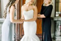 a classic strapless mermaid wedding dress with a draped and sculptural bodice is a cool idea to show off your curves