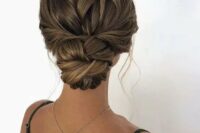 a cool twisted low bun with a twisted loose top and locks down is a chic and stylish idea for long hair, it can be a fit for many bridal styles