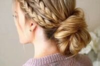 a double braided halo with a low twisted low bun guarantees a picture-perfect look for the whole day