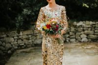 a gold chunky sequin wedding dress with a high neckline and long sleeves plus a train for a glam bridal look