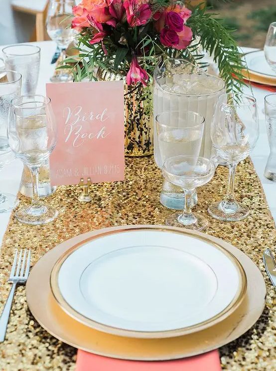 a gold sequin table runner, touches of pink and fuchsia for a bright and glam table setting