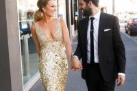 a gorgeous gold sequin mermaid wedding dress with a deep neckline and no sleeves is a fantastic idea for a glam wedding