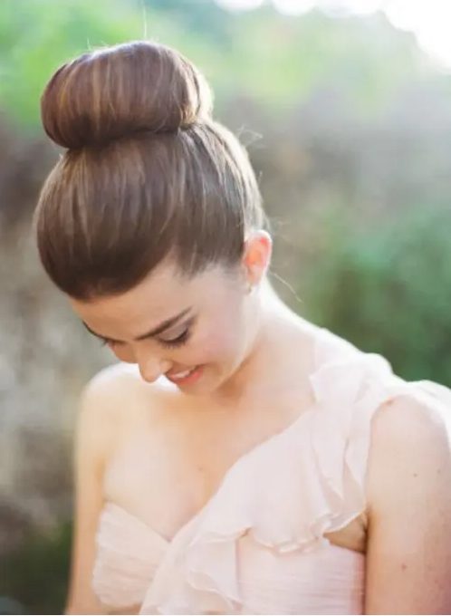 a large top knot is classics that will fit many bridal styles making your look super refined and chic