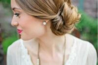 a low side bun with a sleek top is a stylish idea that fits most of bridal styles and looks