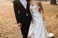 a modern plain strapless wedding dress with a sweetheart neckline and a train is a stylish idea for a modern wedding