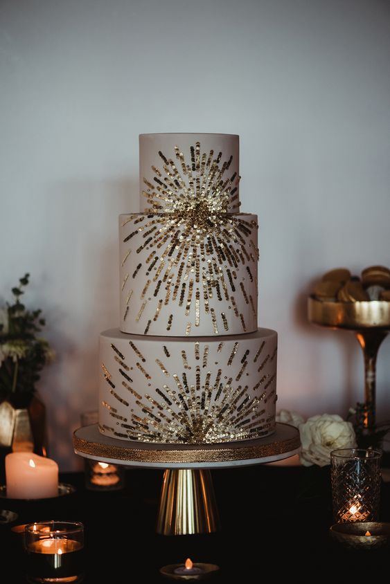 a neutral wedding cake with gold edible sequin is a catchy and chic solution to rock