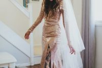 a pink sequin wedding dress with a thigh high slit, a train and a cathedral veil for a glam and edgy look