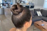 a pretty knotted bun with a sleek top is a chic and stylish solution and a fresh take on a usual bun
