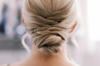 a sleek and tight wedding hairstyle with a twisted low bun and a sleek and tight top is amazing for a wedding