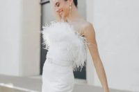 a strapless embellished fitting midi wedding dress with a belt and pearl earrings is a fantastic idea for a glam wedding