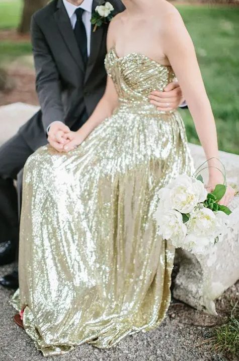 a strapless gold sequin wedding dress is a perfect glam option that will never go out of style