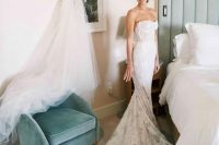 a strapless lace applique mermaid wedding dress with a train is a lovely and chic idea for a modern romantic wedding