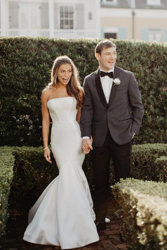 a strapless plain mermaid wedding dress with a train is a cool modern version of a classic mermaid wedding gown