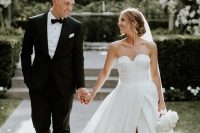 a strapless wedding ballgown with a sweetheart neckline, a pleated skirt with a front slit and embellished shoes for a formal wedding