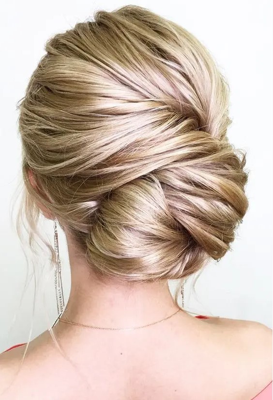 a twisted large low bun is a very chic option, which will easily fit a more formal look