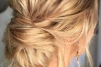 a very messy updo with a low bun and locks down for a casual and effortlessly chic look