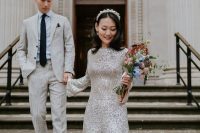 a white sequin high low wedding dress with bell sleeves and a high neckline, lace up shoes and a headband for a glam wedding