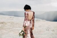 pink sequin long sleeve backless wedding dress with a small train looks stunning and shining