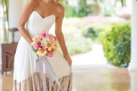 strapless sweetheart creamy wedding dress with a copper sequin skirt and a train by Truvelle