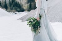 02 a light grey wedding gown with an airy skirt and bodice, long sleeves and a bejeweled crown for a modern winter Nordic look