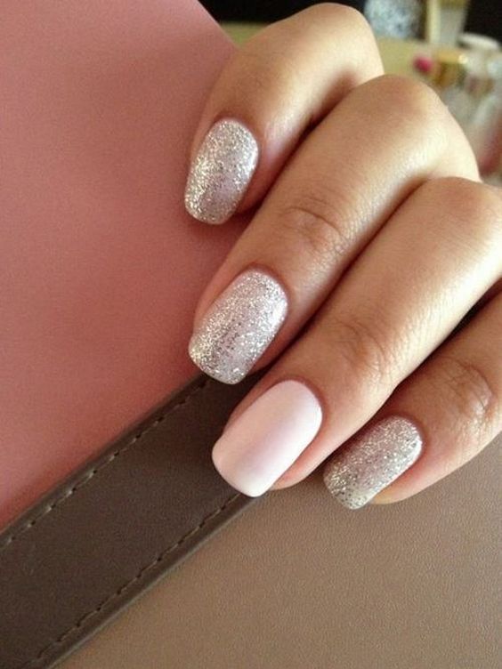 a silver glitter manicure and a blush accent nail for a cute and sweet girlish look