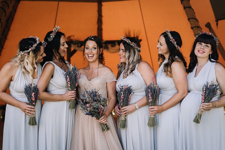 The bridesmaids were wearing silver and grey strap maxi dresses and dried flower crowns
