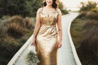 04 a chic gold sequin wedding gown with cap sleeves and a fluttering cut plus a train for a sparkly look