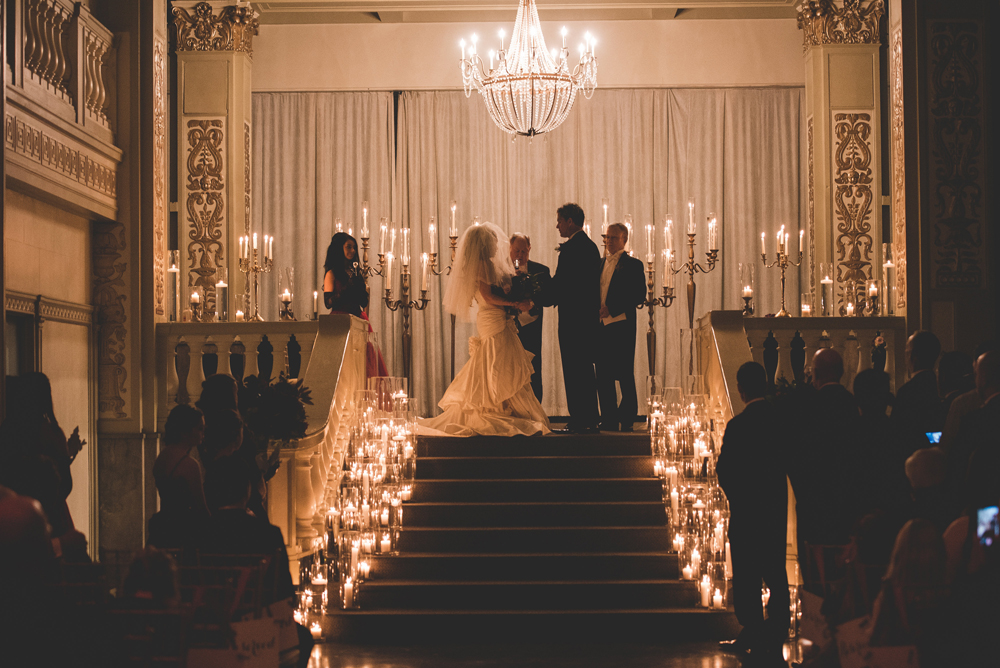The ceremony was candlelit, with the couple standing up the stairs