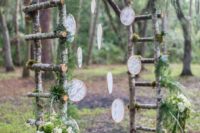 05 a birch branch arch with greenery and lace dream catchers fits a boho woodland wedding