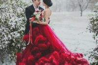 05 a jaw-dropping red strapless wedding gown with a super ruffled and long train is a bold statement at Christmas