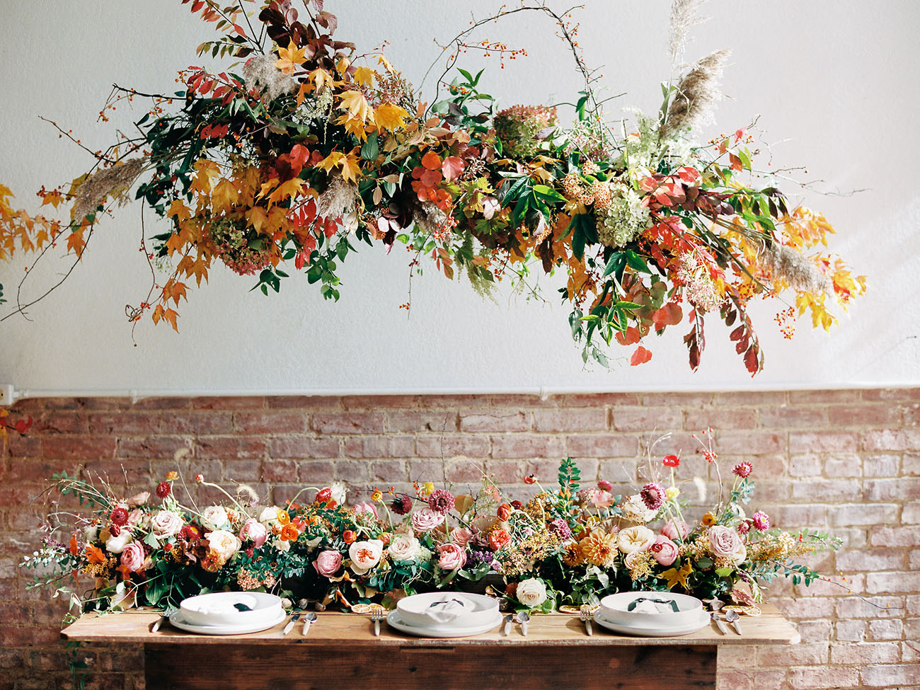 The wedding reception featured a lot of lush and bold florals that brought truly a fall spirit