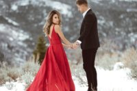 06 a bright red plain wedding gown with wide straps, a V-back and a train for a gorgeous ultimately elegant look