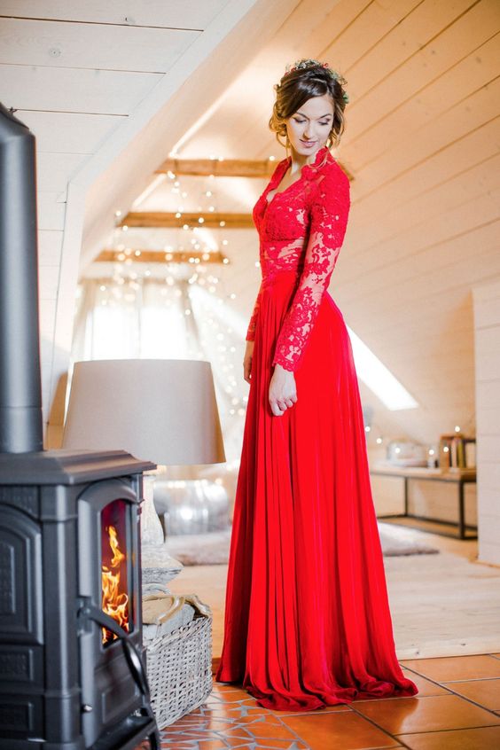 a hot red wedding gown with a lace bodice and long sleeves and a plain skirt is a truly Christmassy idea