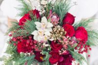 06 a lush Crhsitmas wedding bouquet with holly berries, bold blooms, orchids, succulents and evergreens