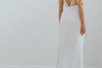 06 a minimalist wedding dress with a cutout geometric back and sheer detailing plus a train for a minimal bride