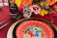07 The wedding tablescape was done in black, red and gold, with sugar skulls, bright blooms