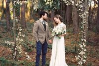 07 a boho branch wedding arch with greenery and leaves for a fall wedding with a retro feel