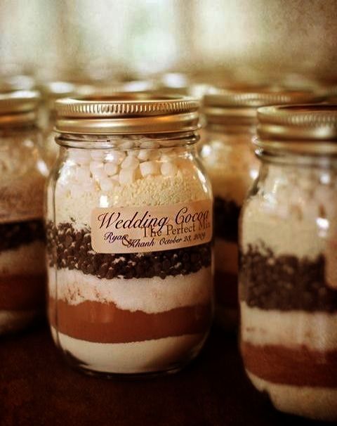 a hot cocoa jar with marshmallows is a great idea for a Christmas wedding, keep your guests warm and cozy