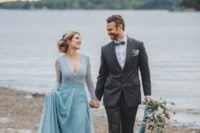 07 a winter Nordic bridal look with a blue wedding gown with a lace bodice and long sleeves, blue is a very trendy color for brides